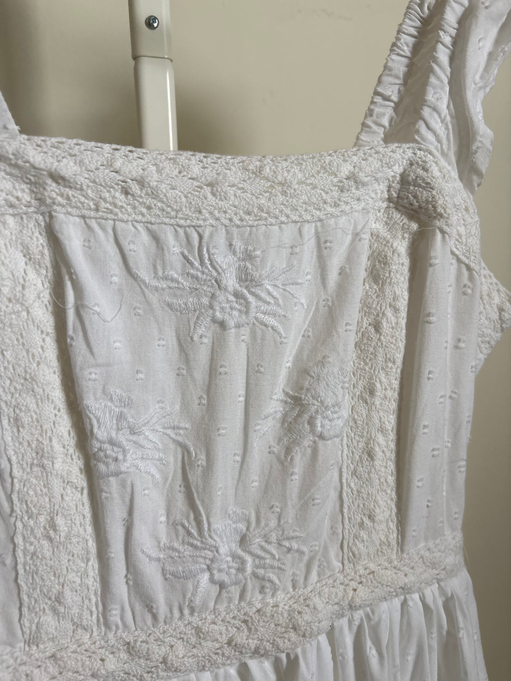 AND NOW THIS EMBROIDERED DRESS S