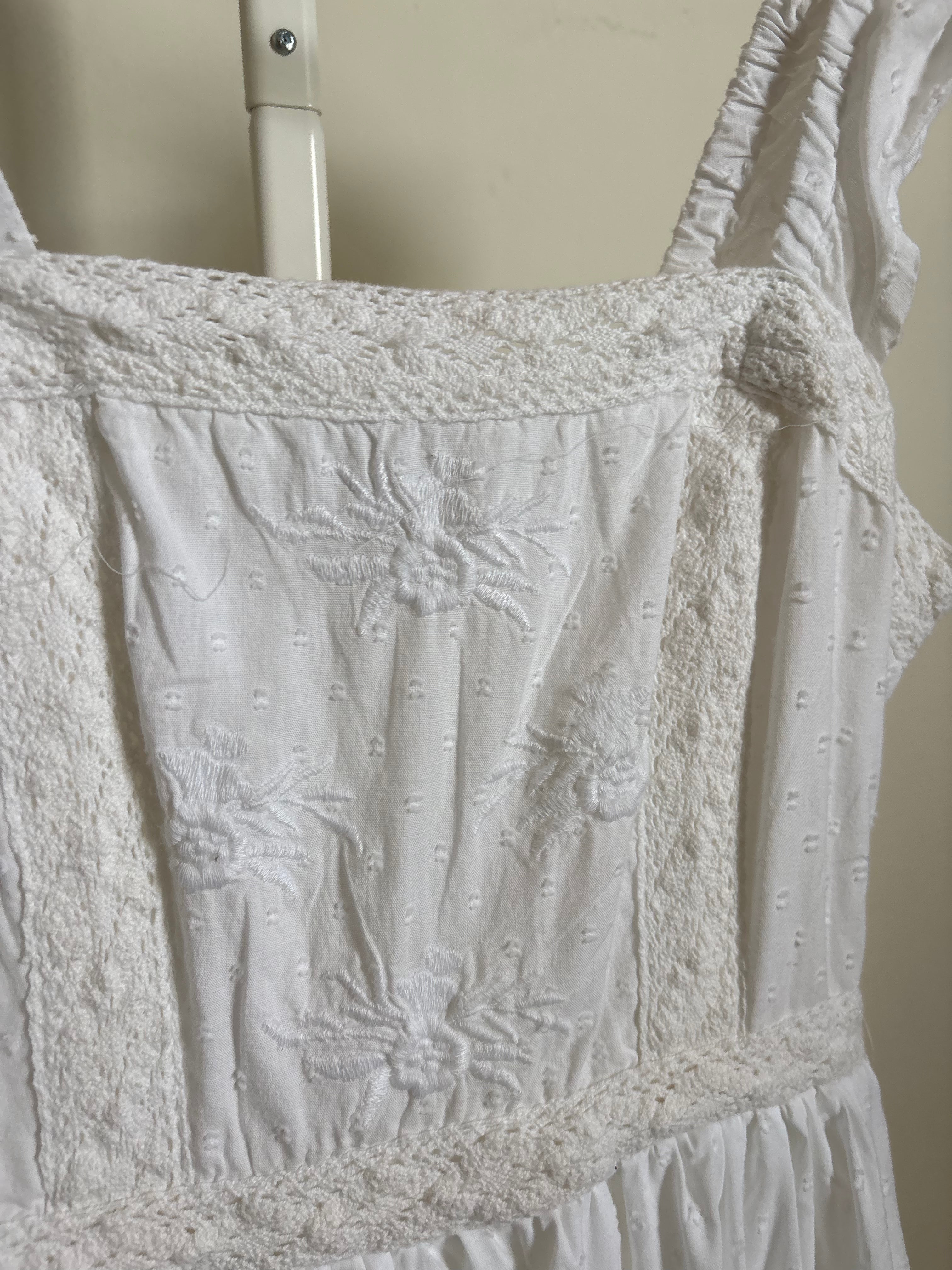 AND NOW THIS EMBROIDERED DRESS S